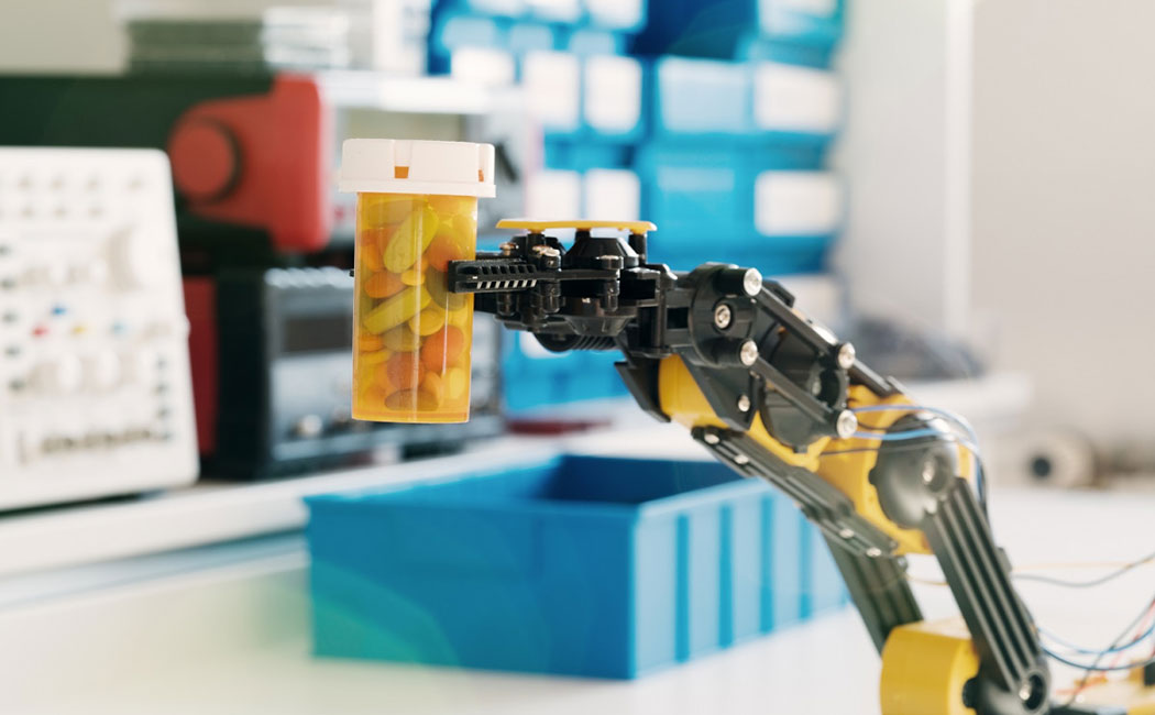 robotic arm holding a bottle of pills